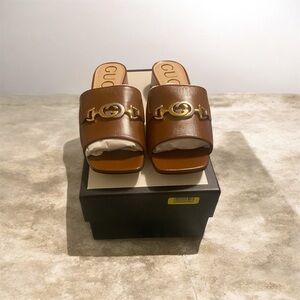 Gucci Brown Slides with Gold Detailing